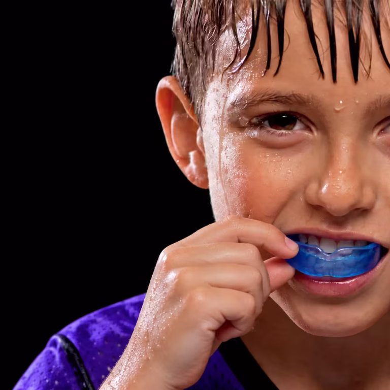 Focused Athlete with Blue Mouthguard